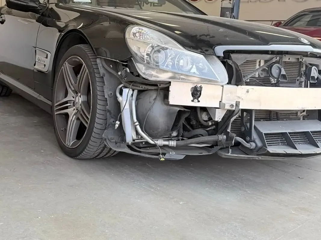 Mercedes-Benz with collision damage — Front-end collision — before repair at F1 Collision, Van Nuys