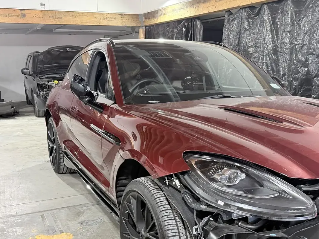 Sport SUV with collision damage — Front-end collision — before repair at F1 Collision, Van Nuys