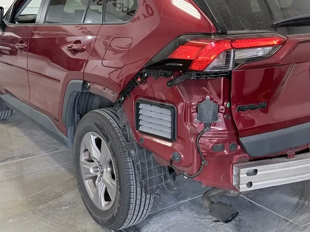 Compact SUV with collision damage — Rear quarter panel — before repair at F1 Collision, Van Nuys