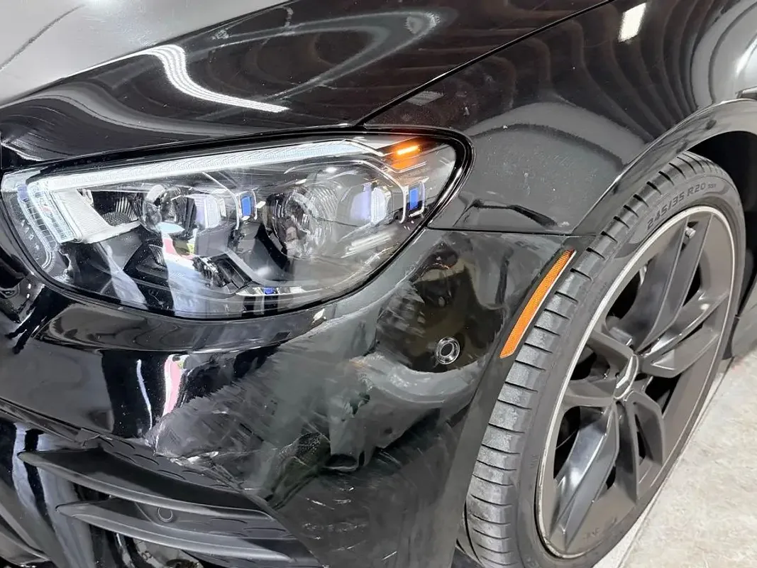 Mercedes-Benz with collision damage — Front fender and headlight — before repair at F1 Collision, Van Nuys