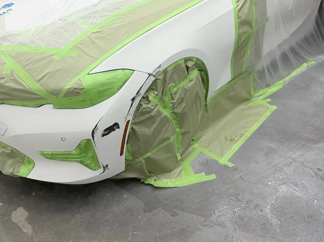 BMW with collision damage — Front bumper and fender — before repair at F1 Collision, Van Nuys